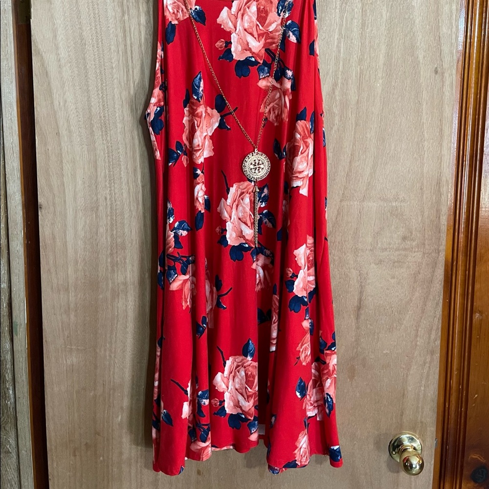 Cute short Red dress with blue and pink flowers and an attached necklace.